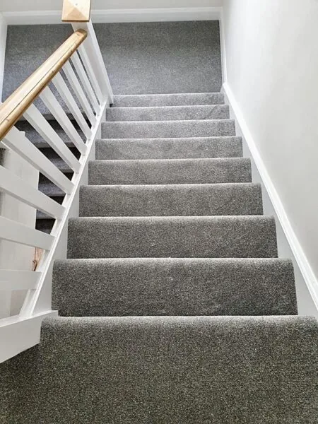 Wall-to-wall coverage or an open stair runner